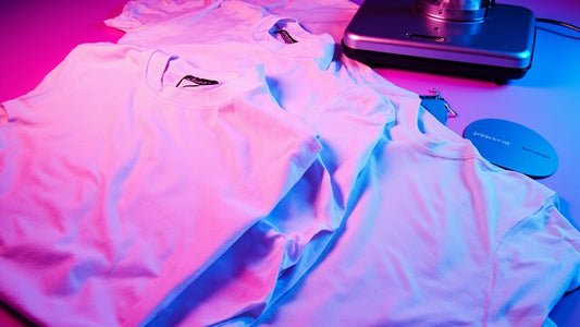 dtf transfer sheets and uv stickers with heat press on clean table